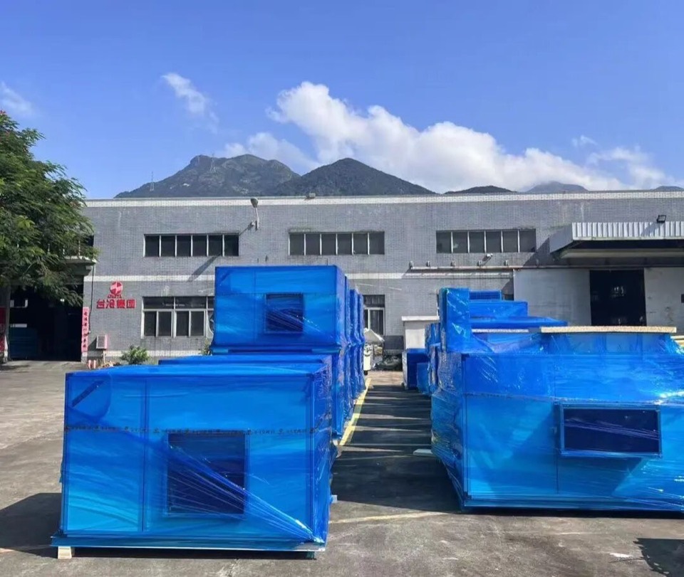 Wrapped Taile air handling units staged in front of the Taile Group factory building